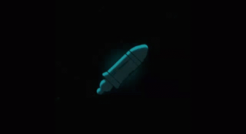 A Rocket Is Glowing In The Dark With A Black Background GIF