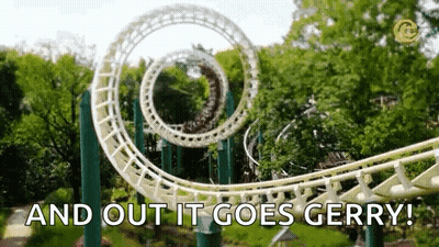 A Roller Coaster In A Theme Park With The Words `` And Out It Goes Gerry '' Written On It . GIF