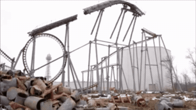 A Roller Coaster Is Being Built In The Middle Of A Pile Of Junk GIF