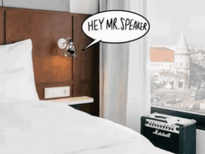 A Room With A Bed And A Speaker That Says Hey Mr Speaker GIF
