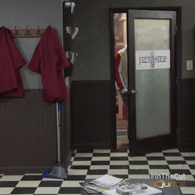 A Room With A Checkered Floor And A Door That Says Jaws Shop GIF