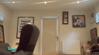 A Room With A Few Framed Pictures On The Wall One Of Which Says ' First ' On It GIF