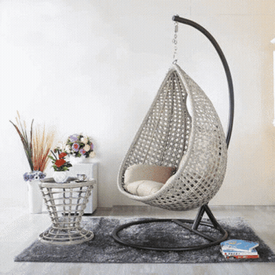 A Room With A Hanging Chair And A Table GIF