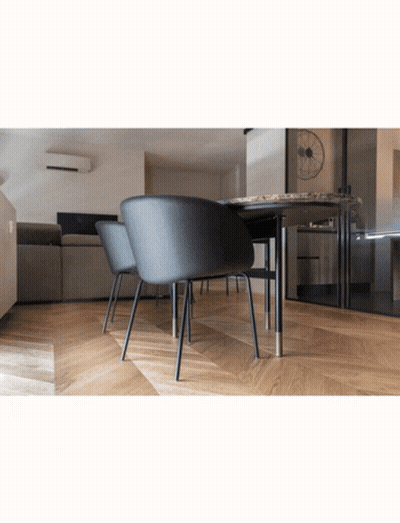 A Room With A Table And Chairs And A Couch GIF
