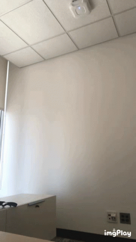 A Room With A White Wall And A Ceiling That Says ' Imgplay ' On The Bottom GIF