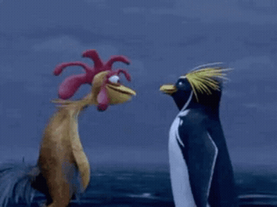 A Rooster And A Penguin Are Standing Next To Each Other In The Ocean . GIF