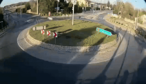 A Roundabout With A Sign In The Middle That Says ' Plockowiec ' On It GIF