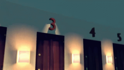 A Row Of Doors With Numbers 3 4 And 5 On Them GIF