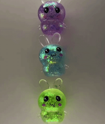 A Row Of Glow In The Dark Toys In The Shape Of A Bee . GIF