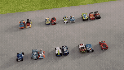 A Row Of Hot Wheels Cars Are Lined Up On The Road GIF