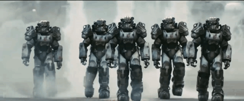 A Row Of Robotic Soldiers Are Lined Up In A Line GIF
