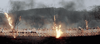 A Row Of Shields Are On Fire With Smoke Coming Out Of Them GIF
