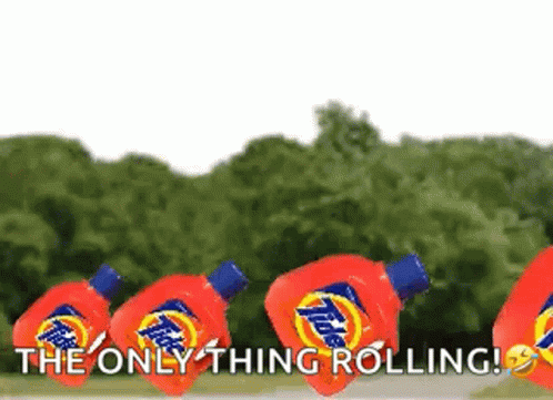 A Row Of Tide Laundry Detergent Bottles Are Floating In The Air GIF