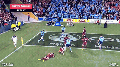 A Rugby Game Is Being Played In A Stadium With Advertisements For Harvey Norman In The Stands GIF