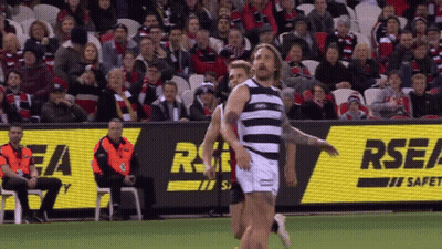 A Rugby Game Is Being Played In Front Of An Rsea Sign GIF