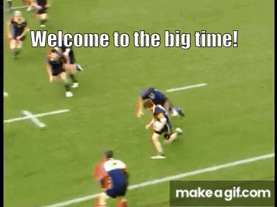 A Rugby Game Is Being Played On A Field With The Words Welcome To The Big Time On The Bottom Of The Screen . GIF