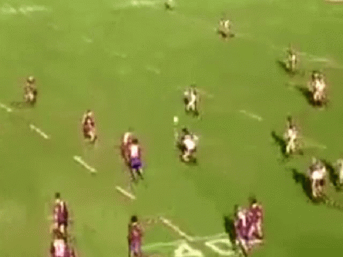 A Rugby Player Wearing Number 11 Is Laying On The Ground GIF