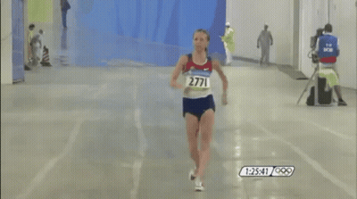 A Runner With The Number 2711 On Her Shirt GIF