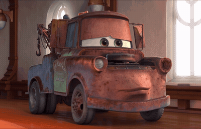 A Rusty Tow Truck With A Green Sign On The Back That Says ' Mater ' GIF