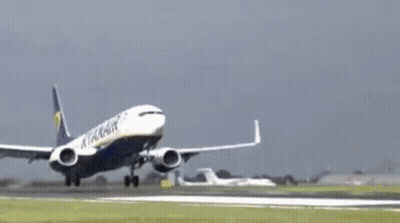 A Ryanair Airplane Is Flying Through The Air GIF