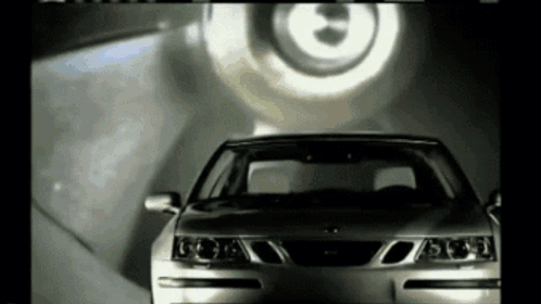 A Saab Car Is Being Advertised In A Black And White Video GIF