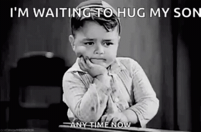 A Sad Little Boy Is Sitting At A Desk With His Hand On His Chin And Waiting To Hug His Son . GIF