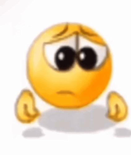 A Sad Smiley Face With A Tear Coming Out Of Its Eyes Is Sitting On The Ground . GIF