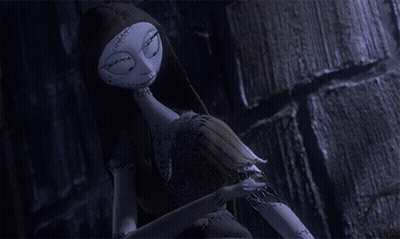 A Sally Doll From The Nightmare Before Christmas Talks On A Cell Phone GIF