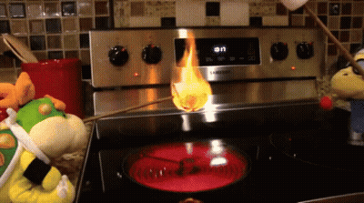 A Samsung Stove With A Marshmallow Being Cooked On It GIF