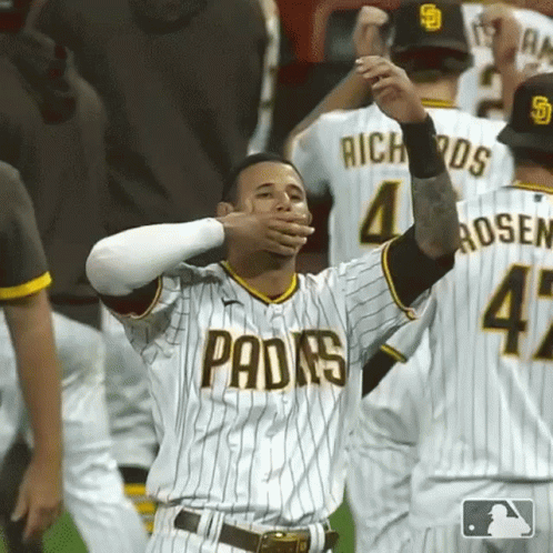 A San Diego Padres Baseball Player Is Covering His Mouth With His Hands GIF