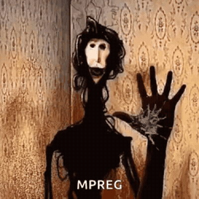 A Scary Puppet Is Standing In Front Of A Wall And Waving At The Camera . GIF