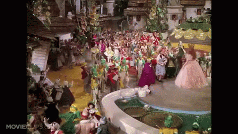 A Scene From The Movie The Wizard Of Oz With A Lot Of People GIF