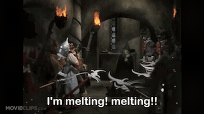 A Scene From The Movie Wizard Of Oz With The Words I 'M Melting Melting !! GIF