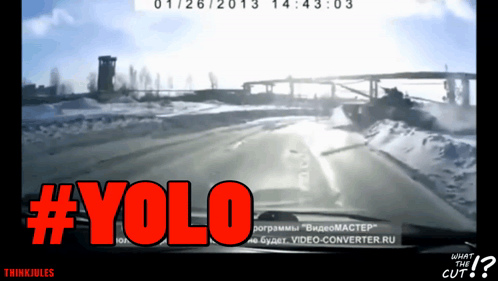 A Screen Shot Of A Car Driving Down A Snowy Road With The Words #Yolo In Red GIF