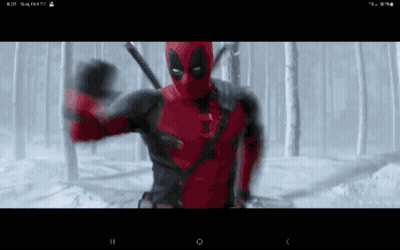 A Screen Shot Of A Deadpool Movie On A Cell Phone GIF