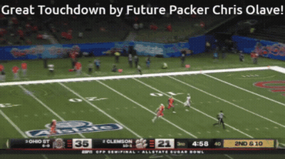 A Screen Shows A Football Game Between Ohio St And Clemson At The Allstate Sugar Bowl GIF