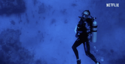 A Scuba Diver Is Swimming In The Ocean With A Netflix Logo In The Background GIF