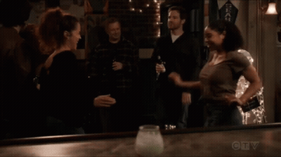 A Seahawks Banner Hangs On The Wall Above A Bar GIF