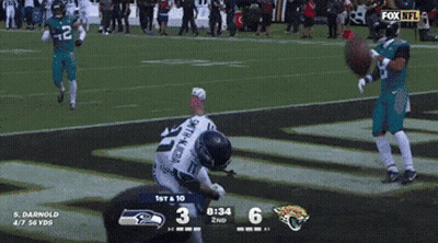 A Seahawks Football Player Is On The Field With A Fox Nfl Logo In The Background GIF