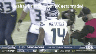 A Seahawks Player With The Number 14 On His Back GIF