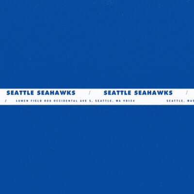A Seattle Seahawks Logo With A Man Holding A Football GIF