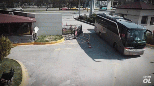 A Setra Bus Is Parked In Front Of A Building With Above Ol Written On The Bottom GIF
