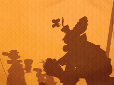 A Shadow Of Goofy Is Cast On A Yellow Wall GIF