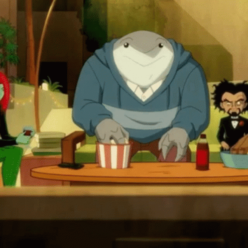 A Shark Is Sitting At A Table With A Bowl Of Popcorn And A Bottle Of Soda GIF
