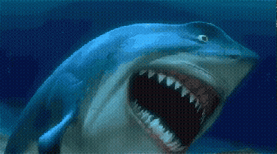 A Shark With Its Mouth Open Is Swimming In The Water GIF