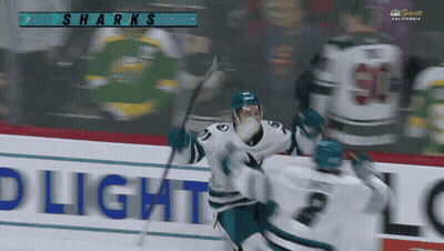 A Sharks Hockey Game Is Being Played In A Stadium GIF