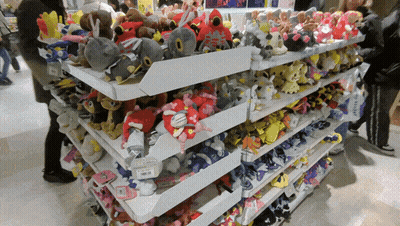 A Shelf Full Of Stuffed Animals With A Price Tag That Says ' Samsung ' On It GIF