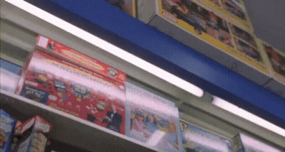 A Shelf Full Of Toys Including A Magic Show Box GIF