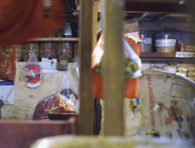 A Shelf With A Few Jars On It Including One That Says ' Spice ' GIF