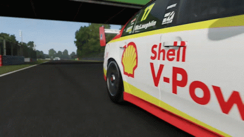 A Shell V-Power Race Car Is Driving Down The Road GIF